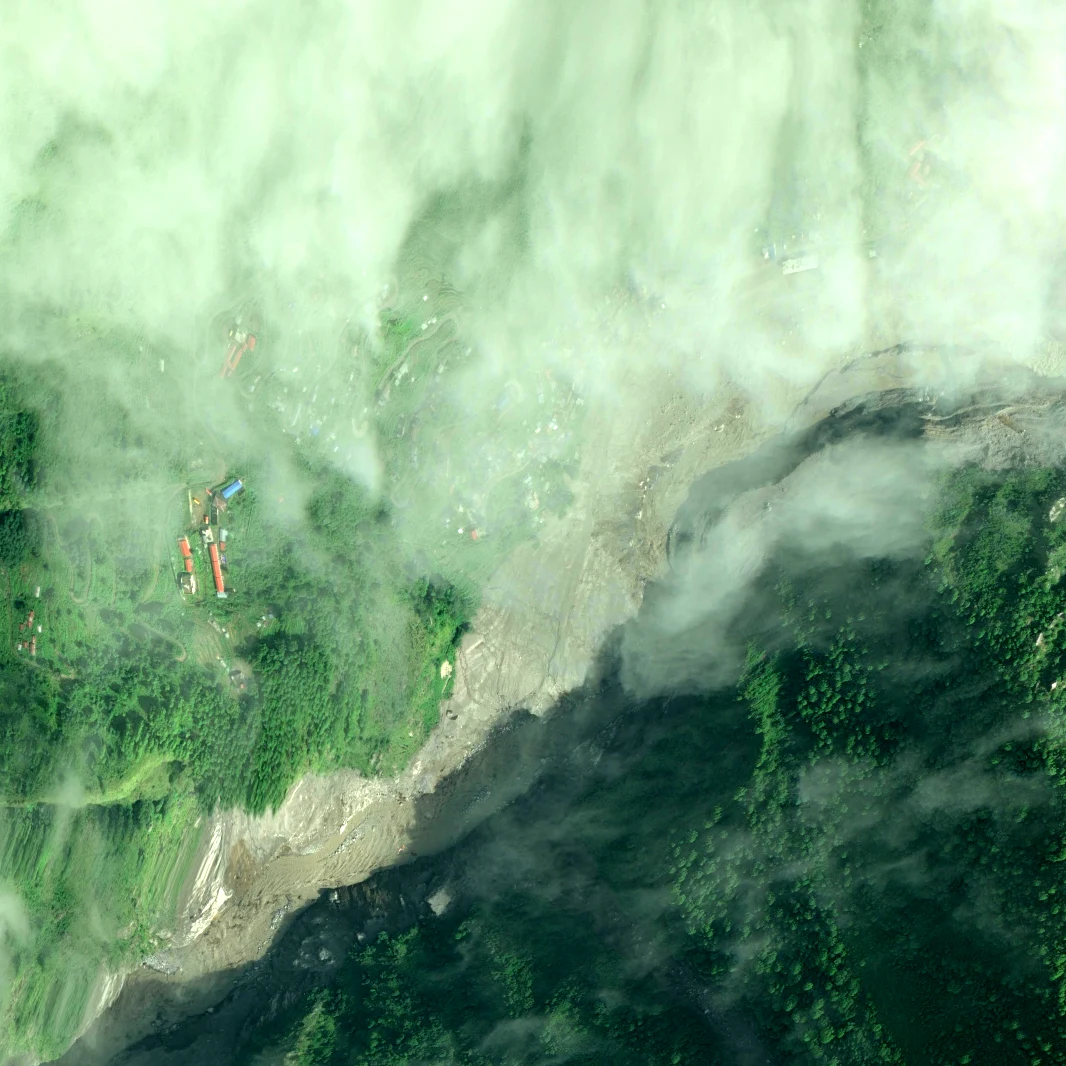 Syabrubesi confluence on 1 September 2026, a defined river channel re-established through the debris sheet