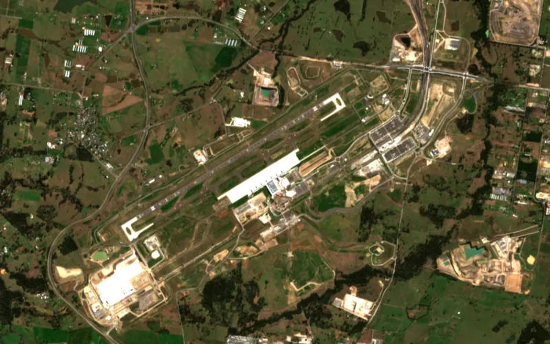 Sentinel-2 image of the Western Sydney International Airport site, Aug 2025: Terminal roof and aprons in place, access roads under way.