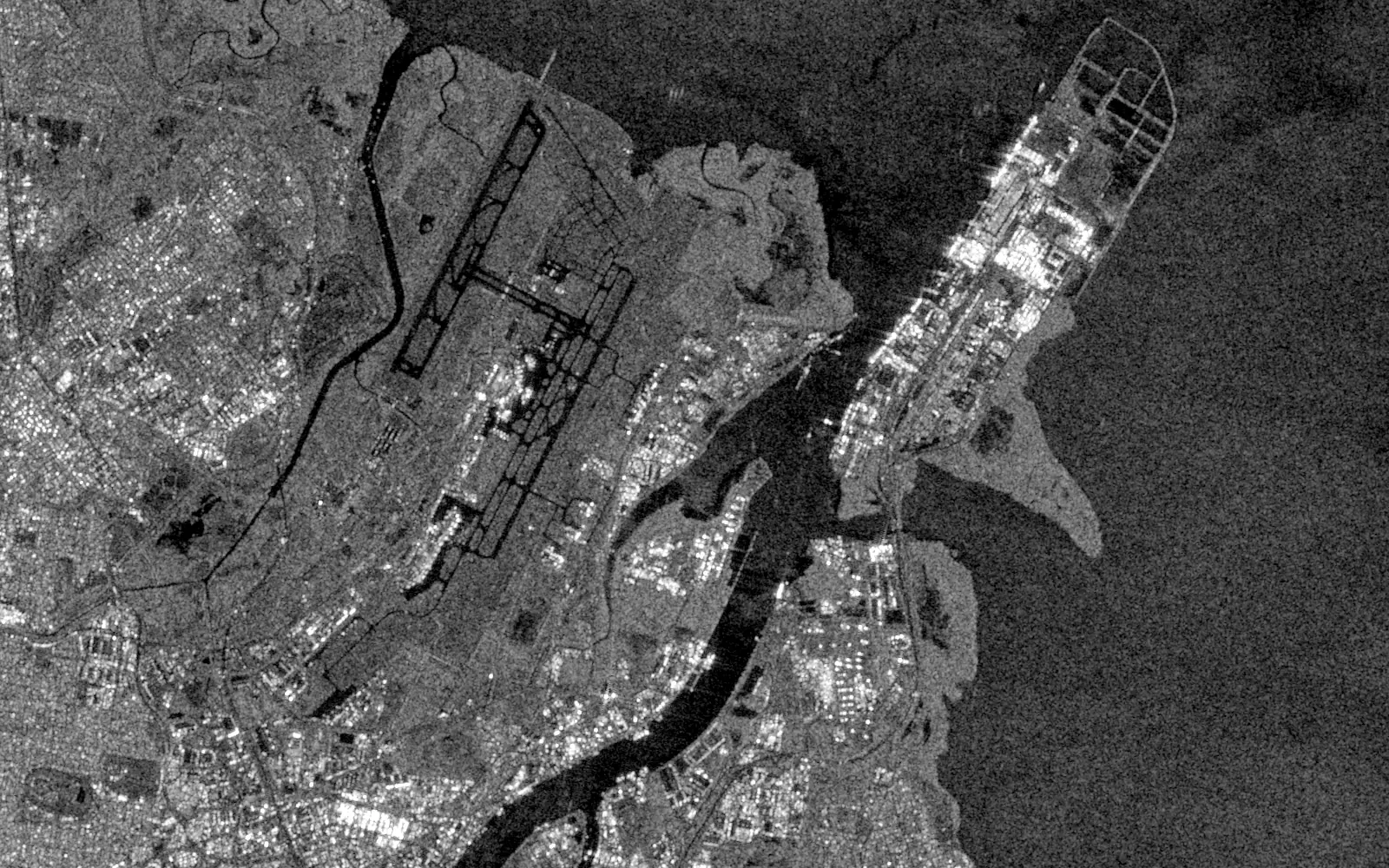 Sentinel-1 radar image of the same area before sunrise the next morning: Brisbane Airport runways, the port, the river mouth and Moreton Bay are all visible.